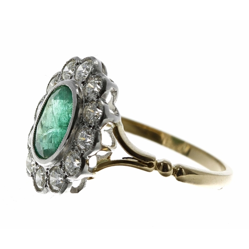 19 - Attractive 18ct and platinum emerald and diamond oval cluster ring, the emerald 1.50ct approx, with ... 