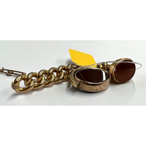 23 - Yellow metal knot design brooch, with safety chain, 6.6gm, 49mm wide; gold hardstone cameo swivel fo... 