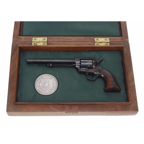Uberti, Italy - inert miniature scale reproduction six shot revolver, stamped Pat July 25 1871 and July 2 1872, serial no. 3299, marked Uberti Italy to the 3.25" barrel, wooden grips, presented in a walnut case with an 1889 one dollar coin