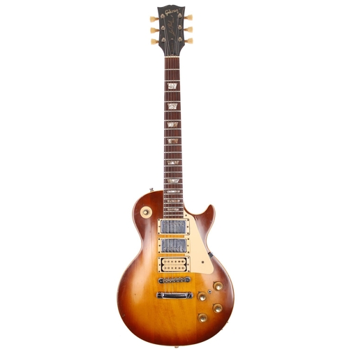 1974 Gibson Les Paul Standard electric guitar, made in USA; Body: sunburst finished three piece pancake body, finish loss to back edges, buckle rash, further dings and marks; Neck: rebound and refinished including head face, some lacquer lifting; Fretboard: rosewood; Frets: mild wear, refret; Electrics: working, DiMarzio pickup installed to bridge position with original bridge pickup shifted up into the middle position and body tidily routed to fit, neck and middle pickups original Patent sticker humbuckers, coil switch added, potentiometers dating to 1974 with some re-soldering work visible; Hardware: generally good, replacement locking strap buttons, replacement jack plate; Case: original hard case; Weight: 4.60kg; Overall condition: fair