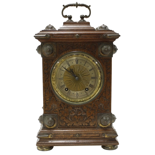 1502 - German gothic oak ting-tang mantel clock, the W & H movement striking on two gongs, the 4.75