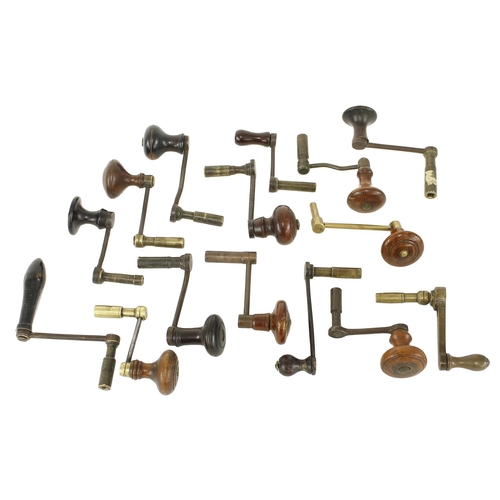 2103 - Fifteen various brass and iron crank handle clock keys with turned wooden handles (15)... 