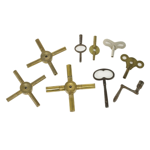 2106 - Three brass spider clock keys; together with a small quantity of other clock keys