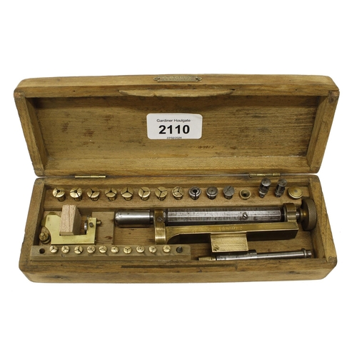 2110 - Small 5mm screw head polisher and collets, within a fitted pine case, 8.25