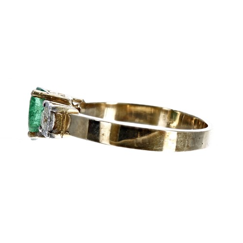 85 - Emerald and diamond three stone 9ct yellow gold ring, the oval emerald 0.50ct approx, flanked by two... 