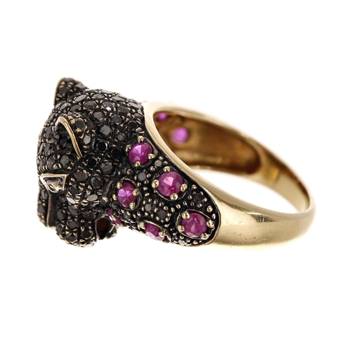 82 - Unusual 18ct yellow gold wild cat design ring, set with rubies and black diamonds, width 15mm, 7gm, ... 