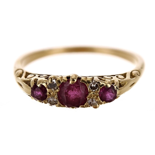 88 - Pretty 18ct claw set ruby and diamond yellow gold ring, with three round rubies and four small diamo... 