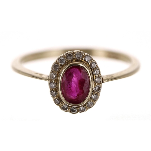 89 - 18ct yellow gold oval ruby and diamond cluster ring, the ruby 0.50ct approx, width 9mm, 2.3gm, ring ... 