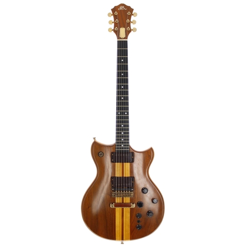 Bernie Marsden - Whitesnake era 1979 Greco/Roland G-808 guitar synthesizer controller, made in Japan, ser. no. L796419; Body: natural walnut and maple, dings and scratches throughout; Neck: walnut and maple; Fretboard: ebony; Frets: good; Electrics: output from bridge pickup, neck pickup in need of investigation, midi function untested; Hardware: generally good, some tarnishing to metal parts, replacement control knobs, damage to one control knob; Case: original hard case bearing 'Bernie Marsden' stencil to the lid; Weight: 4.08kg; Overall condition: good for age