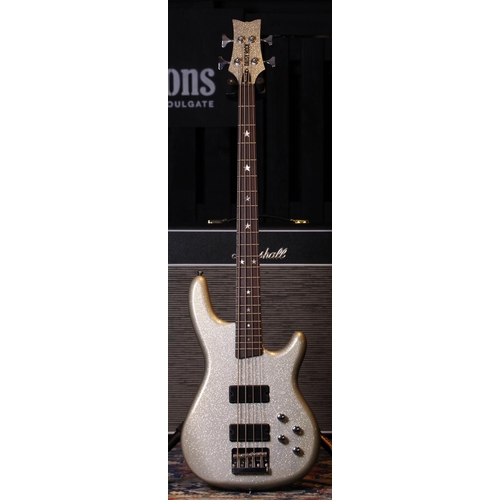 506 - Daisy Rock Rock Candy bass guitar, made in China; Body: champagne sparkle finish; Neck: maple; Fretb... 