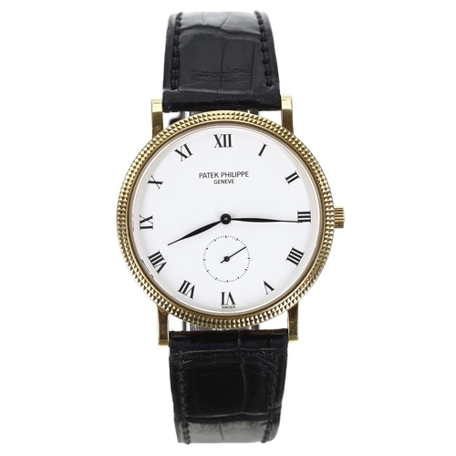 Patek Philippe Calatrava 18ct gentleman's wristwatch, reference no. 3919, hobnail bezel, white dial with Roman numerals and a subsidiary seconds dial, signed crown, calibre 215PS movement, Patek Philippe black leather strap with signed 18ct buckle, 34mm