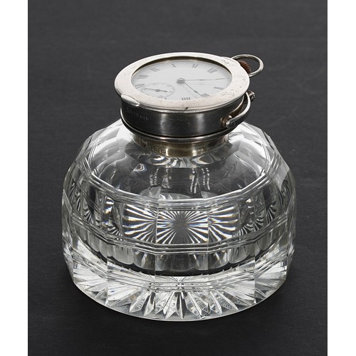 906 - Cut glass desk inkwell with silver swivel cover enclosing a Swiss silver engine turned pocket watch,... 