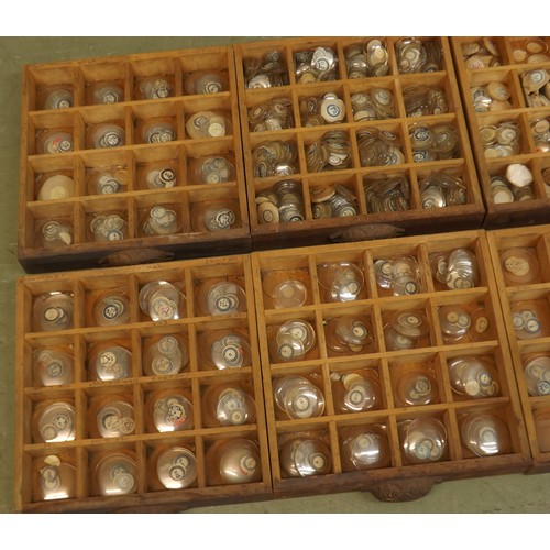 912 - Eight drawer wooden chest containing a large quantity of various sized watch glasses, 16.25'' high x... 