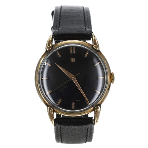 229 - Universal gold plated gentleman's wristwatch, circular black dial with gilt hour markers and centre ... 