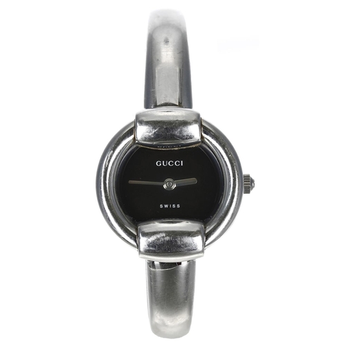 299 - Gucci stainless steel lady's bangle wristwatch, reference no. 1400L, black dial, quartz, 26mm... 