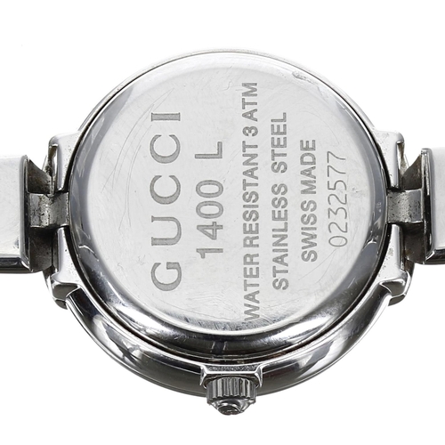 299 - Gucci stainless steel lady's bangle wristwatch, reference no. 1400L, black dial, quartz, 26mm... 