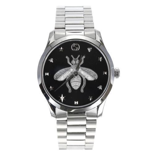 301 - Gucci G Timeless stainless steel wristwatch, reference no. 126.4, black dial with large centre bee m... 