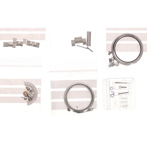 466 - Omega - Quantity of assorted Omega parts to include black tachymetre bezel with crystal, seal, windi... 