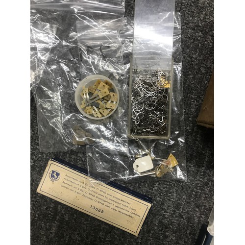 486 - Quantity of watch and clock parts and spares to include wristwatch hands, pocket watch and wristwatc... 