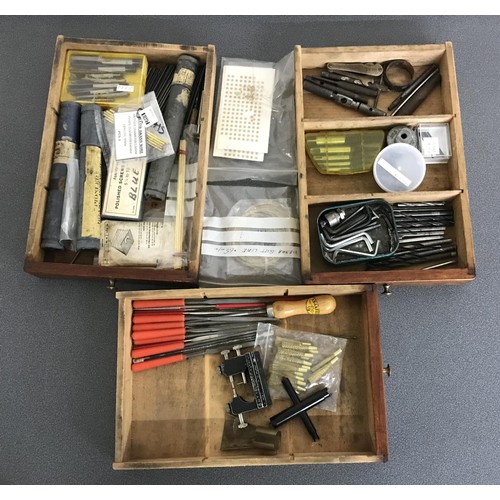 926 - Fourteen drawer wooden chest containing a quantity of assorted watch makers tools and parts/spares t... 