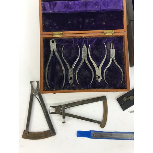 929 - Two cased sets of antique writing/drawing instruments; together with a cased set of plier tools and ... 