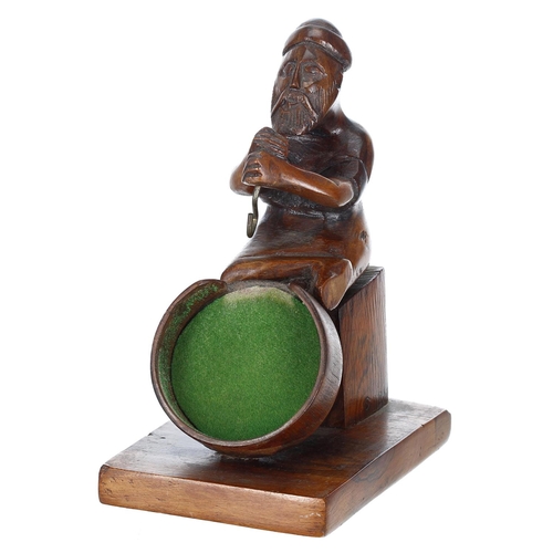 908 - Novelty fruitwood figural carved pocket watch display stand, modelled as a seated gentleman with his... 