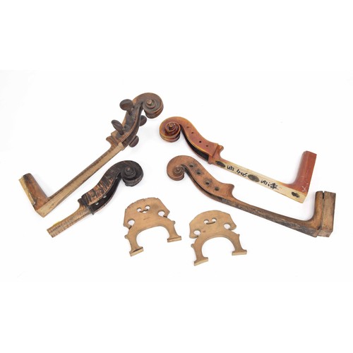 2501 - Four old violoncello scrolls and necks; also two double bass bridges