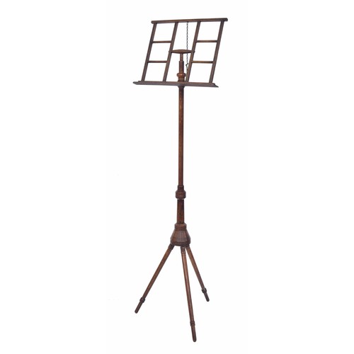 1600 - Arts & Crafts Liberty style oak adjustable tripod music stand, upon turned legs