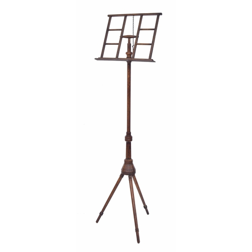 1600 - Arts & Crafts Liberty style oak adjustable tripod music stand, upon turned legs