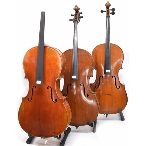 2502 - Three three-quarter size violoncellos in need of restoration, hard case and two soft cases (3)... 