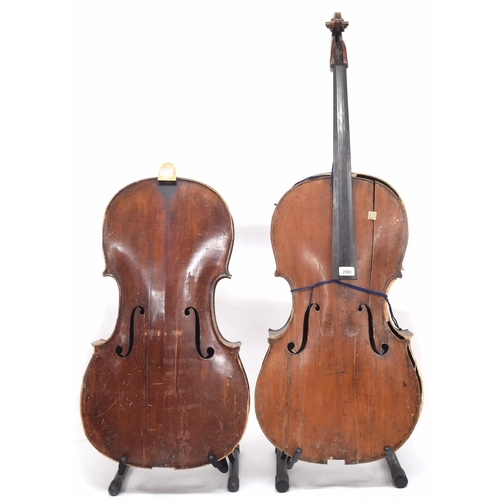 2503 - Two full size violoncellos in need of extensive restoration, one without neck and scroll, two hard c... 