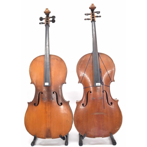 2504 - Two full size violoncellos in need of restoration, two hard cases (2)