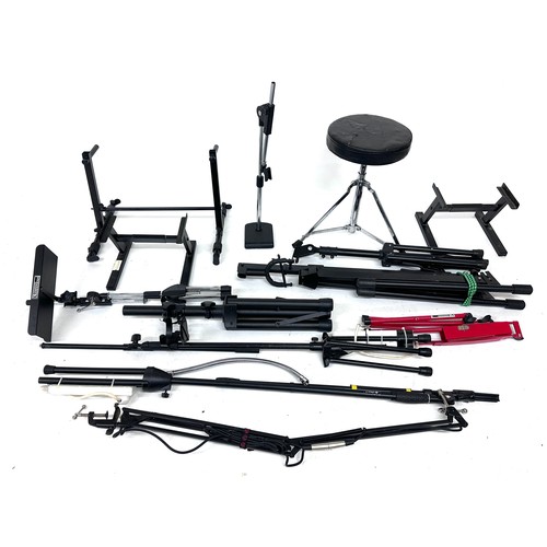 1241 - Good selection of various stands to include two folding rack guitar stands, speaker stands, micropho... 