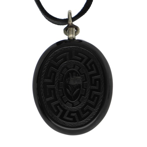 267 - Victorian oval jet mourning locket pendant, set with agate with Greek key decoration, the interior w... 