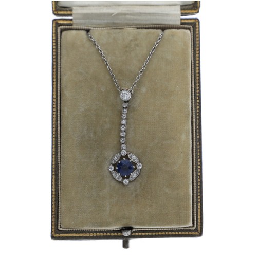 Attractive antique platinum sapphire and diamond necklace, the old-cut sapphire 0.60ct approx, in a halo setting setting with round old-cut diamonds, integral necklace with a 15ct yellow gold clasp, 4.7gm, the pendant 36mm   
