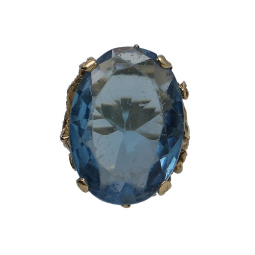 111 - Large 9ct yellow gold blue paste set oval ring, 12.1gm, width 25mm, ring size Q/R