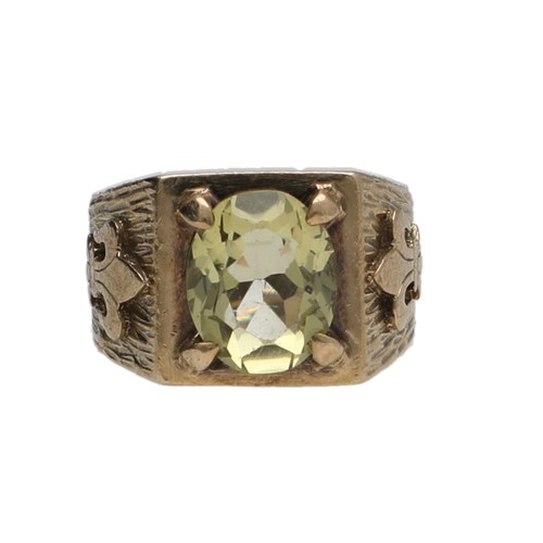 180 - 9ct peridot set ring with fleur-de-Lys motifs to the shoulders, 6.8gm, 12mm, ring size J/K... 