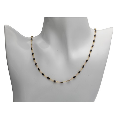 135 - 14ct yellow gold blue sapphire-set necklace, 3.8gm, 19