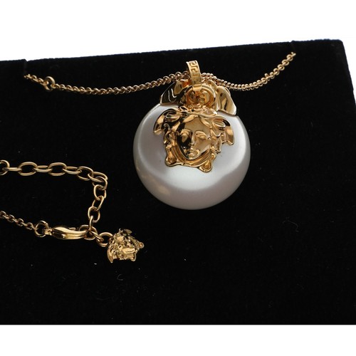 164 - Versace Medusa faux pearl and plated pendant on necklace, with box, tag and booklet