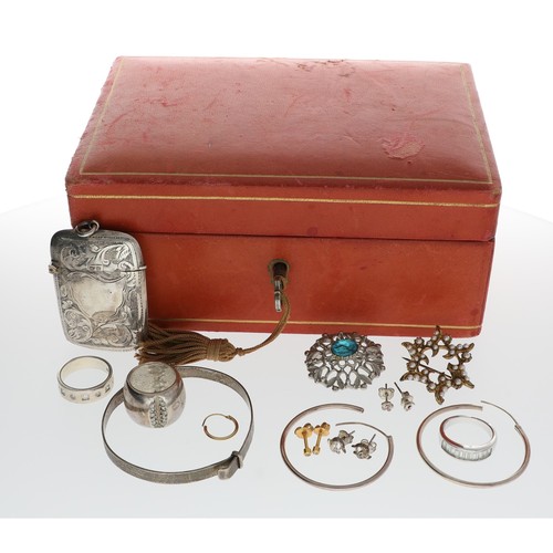 163 - Red leather small jewellery box with a small assortment of to include three rings, silver vesta case... 