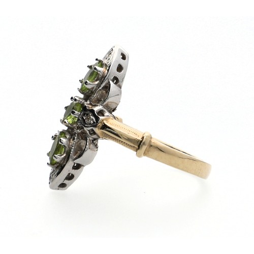 132 - Fancy 9ct white and yellow bold elongated vintage style ring, set with three peridots and round-cut ... 