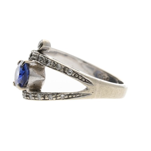 263 - 14ct white gold sapphire and diamond dress ring, the oval sapphire 0.90ct approx, in an open setting... 