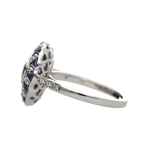 109 - Stylised modern 18ct white gold oval dress ring set, with a central oval diamond surrounded by sapph... 