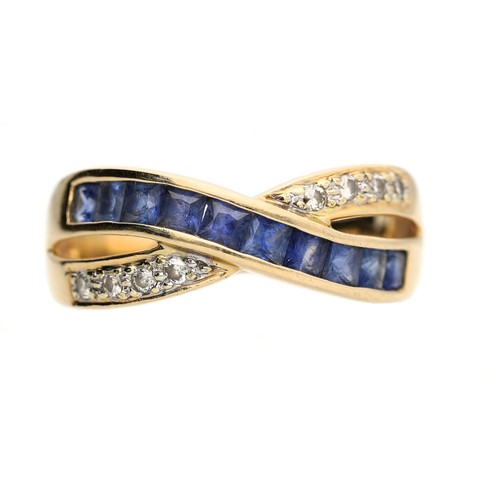 119 - 14ct yellow gold sapphire and diamond cross-over dress ring, with calibrated sapphires and round bri... 