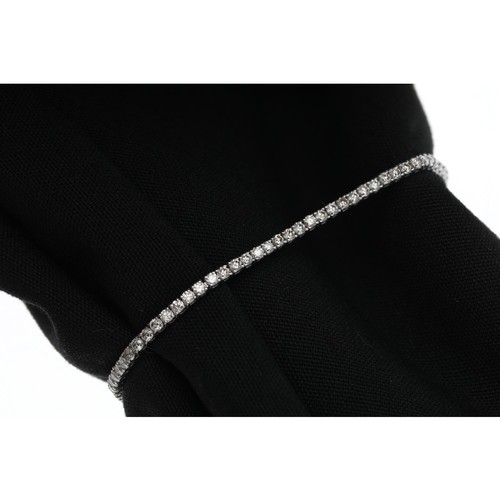 173 - Fine modern 18ct white gold diamond tennis bracelet, with eighty-four round brilliant-cuts, estimate... 