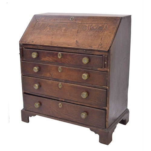 258 - Georgian oak bureau, the hinged fall front enclosing a fitted interior with stationery divisions and... 