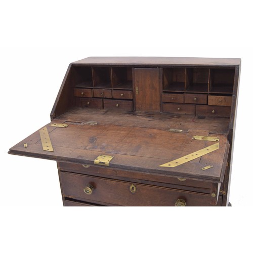 258 - Georgian oak bureau, the hinged fall front enclosing a fitted interior with stationery divisions and... 