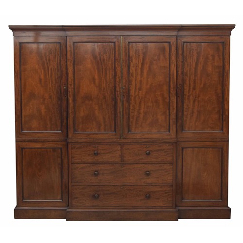 970 - Fine and impressive Victorian mahogany breakfront wardrobe, the stepped cornice over a central pair ... 