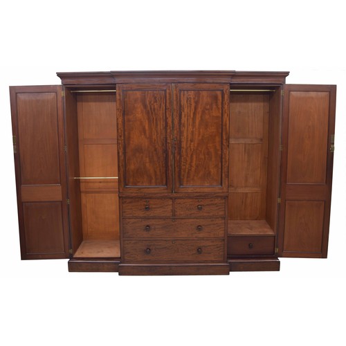 970 - Fine and impressive Victorian mahogany breakfront wardrobe, the stepped cornice over a central pair ... 