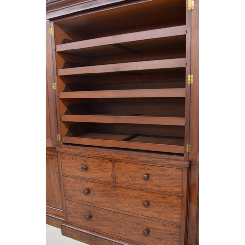 970 - Fine and impressive Victorian mahogany breakfront wardrobe, the stepped cornice over a central pair ... 